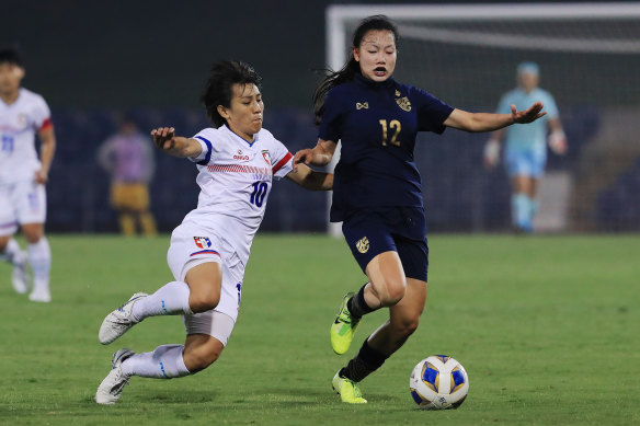 Nutwadee Pram-Nak of Thailand (R) competes for the ball with Tseng Shu-O of Taiwan during the Women's Olympic Football Tournament Qualifier at Campbelltown Stadium. 