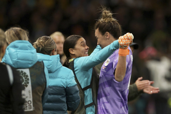 Sam Kerr celebrates with goalkeeper Mackenzie Arnold, right, after Steph Catley scored Australia’s fourth goal against Canada.