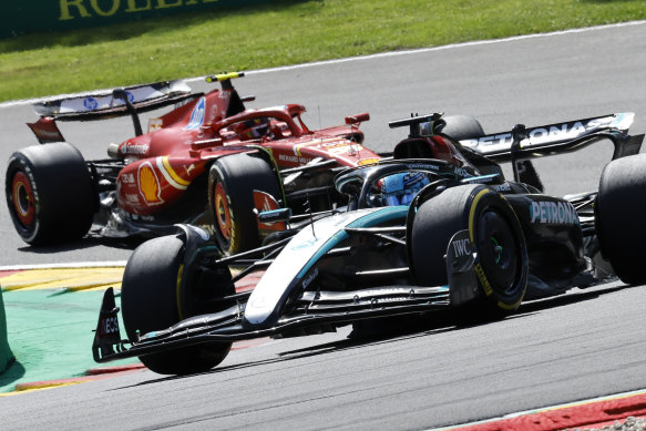 Mercedes driver George Russell, right, steers his car ahead of Ferrari driver Carlos Sainz of Spain.