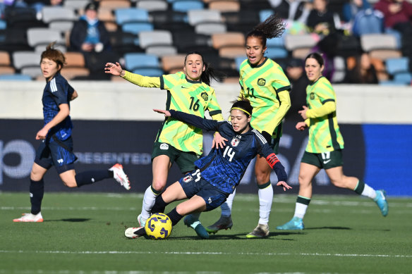 Hayley Raso tackles Yui Hasegawa.