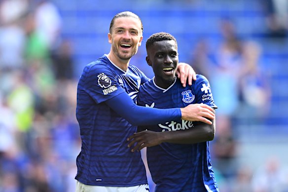 Jack Grealish and Iliman Ndiaye of Everton celebrate following the team’s victory in the Premier League match against Brighton.