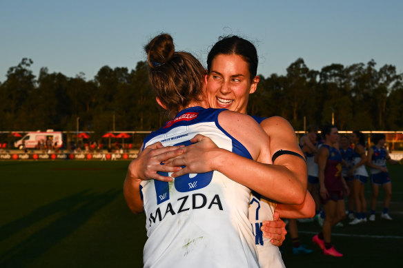 North Melbourne’s star recruit Libby Birch hugs teammate Tahlia Randall following their win in week one this year. 