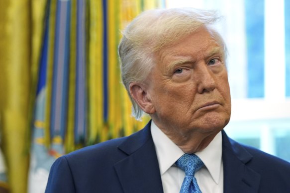President Donald Trump listens during a ceremonial swearing in of Paul Atkins as chairman of the Securities and Exchange Commission in the Oval Office on Tuesday.