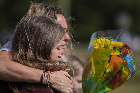 Mourners outside Apalachee High School in the US state of Georgia after a mass shooting last year.