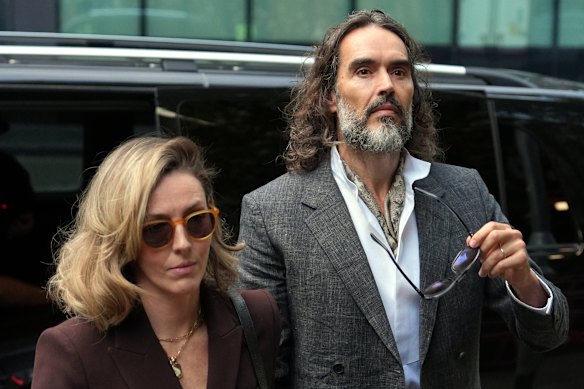 Brand with his wife, Laura, outside court on Monday.