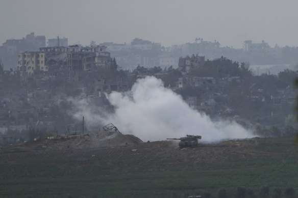 Israeli tanks take position along the Israeli border with the Gaza Strip, as seen from southern Israel.