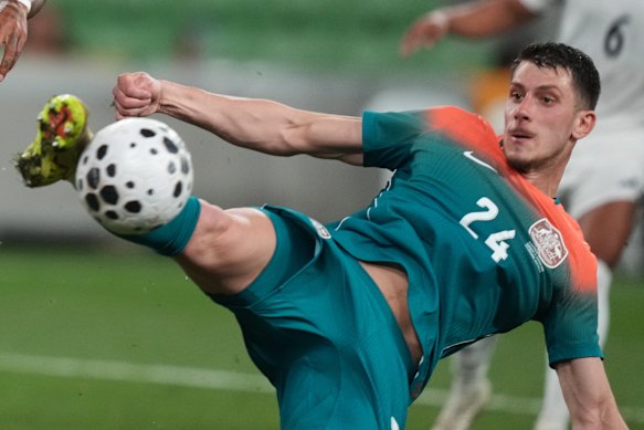 Australia’s Deni Juric clears the ball against Curacao.
