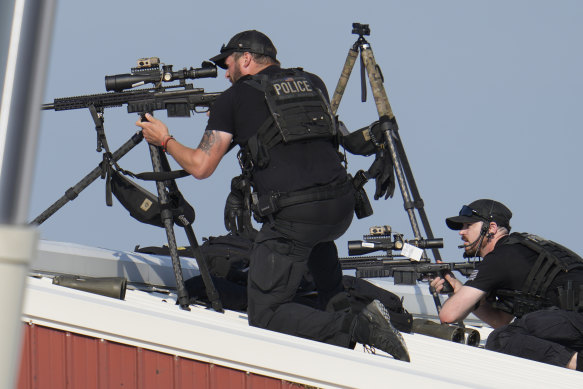 Police snipers after shots were fired while Republican presidential candidate Donald Trump was speaking.