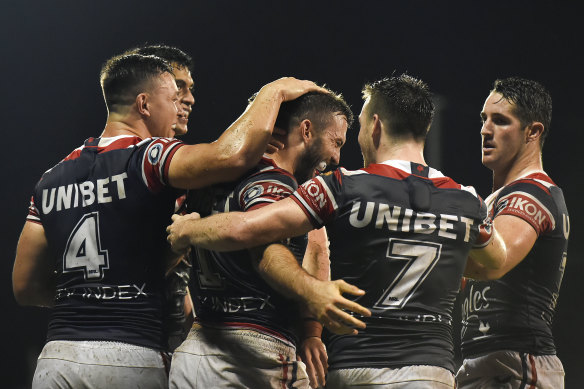 The Roosters celebrate one of hat-trick hero James Tedesco’s tries in the 28-point win over Gold Coast.