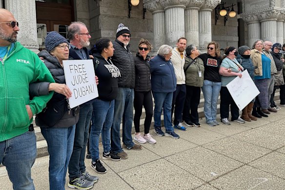 People gather to demonstrate against the arrest of Judge Hannah Dugan  outside the Federal courthouse in Milwaukee.