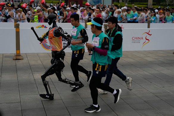 A robot takes part in the Humanoid Robot Half-Marathon in Beijing on Saturday,