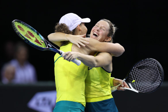 Storm Sanders and Sam Stosur embrace after seeing Australia to victory in the Billie Jean King Cup semi-finals.
