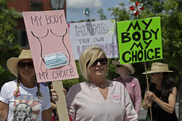 Abortion-rights demonstrators carry signs during a march in Chattanooga, Tennessee in May.