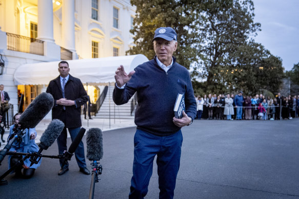 President Joe Biden speaks to members of the media before boarding Marine One on the South Lawn of the White House in Washington.