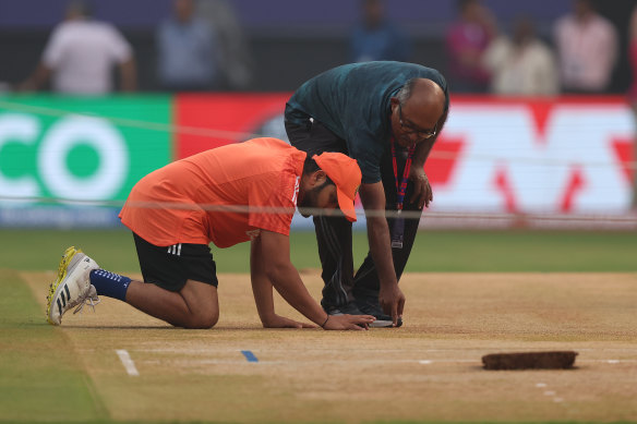 Rohit Sharma inspects the pitch at Wankhede Stadium in Mumbai at a training session this week.