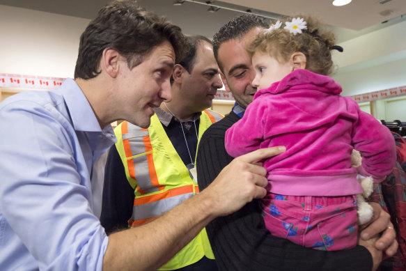 Trudeau welcomes refugees at Toronto’s international airport in 2015.