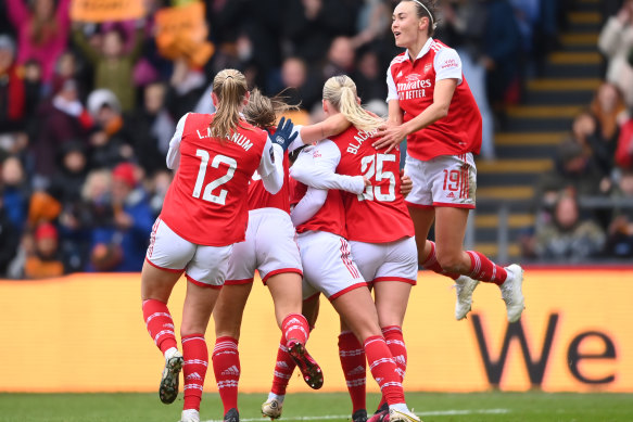 Caitlin Foord (right) and her Arsenal teammates celebrate Stina Blackstenius’ goal.