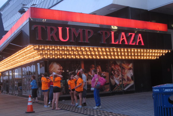 a partially burnt-out sign on the exterior of the Trump Plaza casino in Atlantic City in 2014.