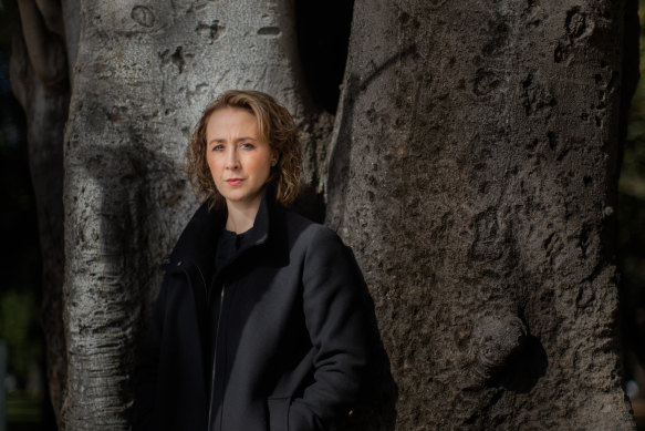 Aboriginal Affairs Minister Gabrielle Williams standing in front of a Moreton Bay fig tree in Carlton Gardens that has significance to Indigenous people.