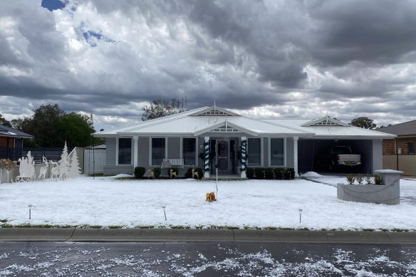 A lawn in Grenfell, south of Orange, is covered in white after hail stones larger than golf balls hit parts of central NSW on Monday.