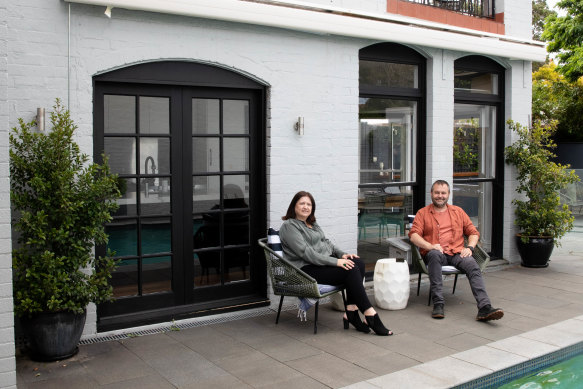 Liz and David Weichert by the pool of their recently sold Stanmore home. 