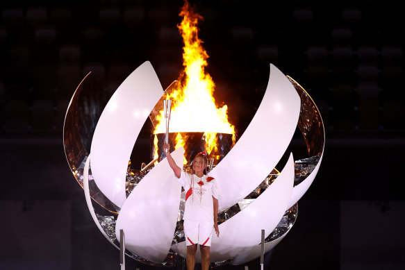 Naomi Osaka of Japan lights the Olympic cauldron at the start of the Tokyo Games. The flame will be extinguished as the Games come to a close on Sunday.