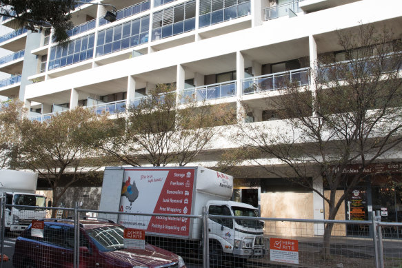 Moving vans outside Mascot Towers.