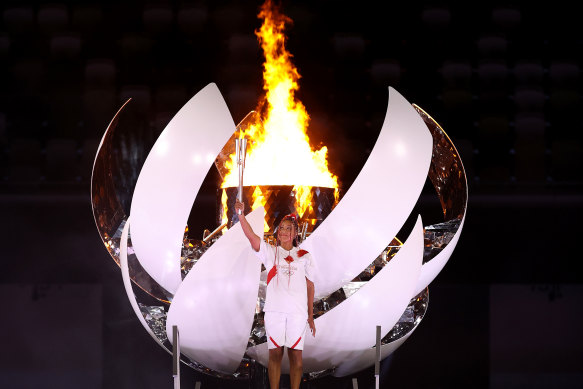 Naomi Osaka of Japan lights the Olympic cauldron at the start of the Tokyo Games. The flame will be extinguished as the Games come to a close on Sunday.