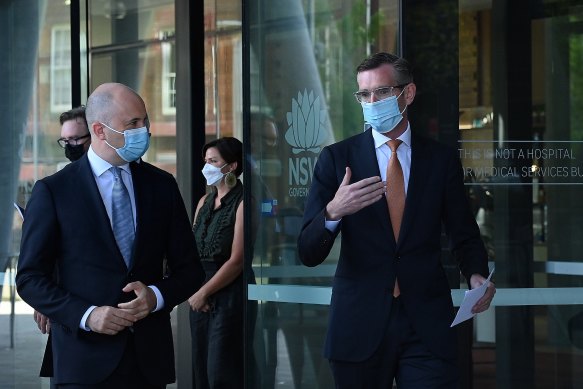 NSW Premier Dominic Perrottet (right) and NSW Treasurer Matt Kean arrive at a COVID-19 update. 