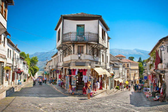 Streets of Gjirokaster … “It was a slanted city, set at a sharper angle than perhaps any other city on Earth, and it defied the laws of architecture and city planning”.