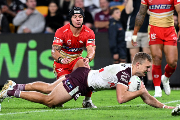 Tom Trbojevic dives over for the first try after the break.