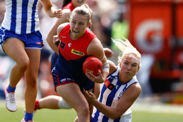 Demons star Tyla Hanks is tackled by the Roos’ Lulu Pullar in the qualifying final.