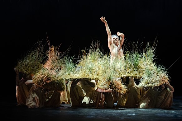 Grasses swirl on stage in one section. 