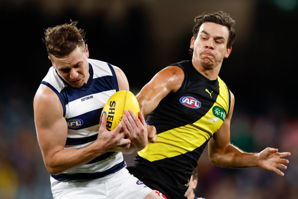 Mitch Duncan of the Cats takes on Tiger Daniel Rioli, who should be back for the Essendon clash.