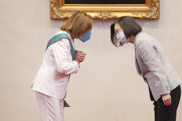 US House Speaker Nancy Pelosi, left, and Taiwanese  President Tsai Ing-wen acknowledge each other during their meeting in Taipei.