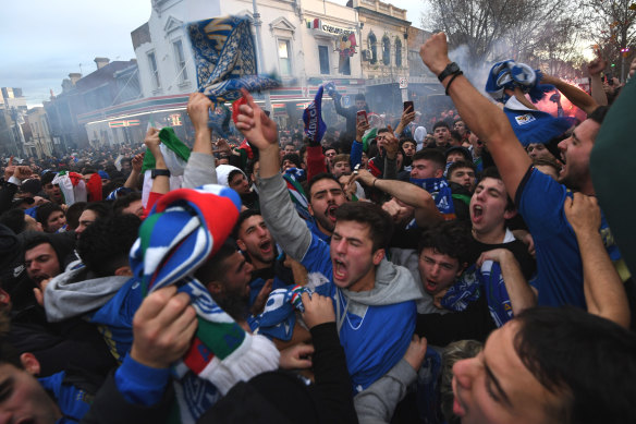 Italian soccer fans celebrate on Lygon Street, Carlton.