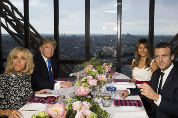 Emmanuel Macron and his wife Brigitte hosted the Trumps at a dinner at the Alain Ducasse restaurant in the Eiffel Tower in 2017. 