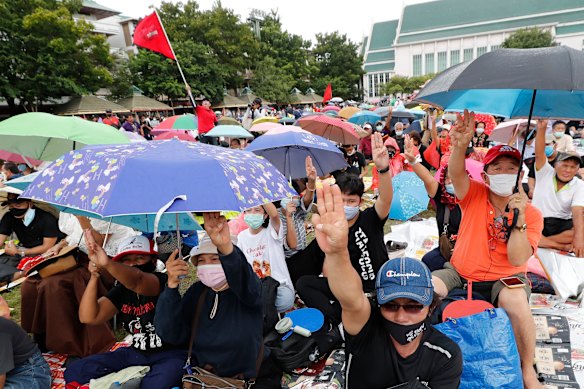 Pro-democracy activists raise a three-fingers salute, a symbol of resistance during a protest at Thammasat University in Bangkok, Thailand, on Saturday.