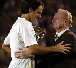 Laver presents the 2006 Australian Open trophy to an emotional Roger Federer.