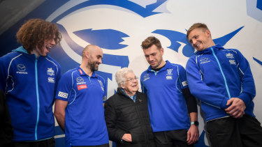 The Kangaroos return the support of longtime fan Dorothy Forth, who was the victim of a home invasion.  Ben Brown, coach Rhyce Shaw, Shaun Higgins and Jack Ziebell were at the presentation.