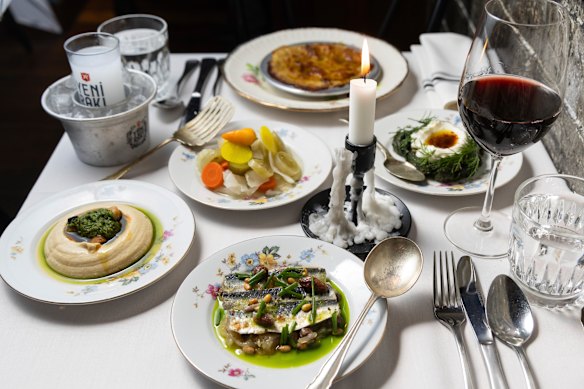 Clockwise from left: Hummus, pickles, braised baby goat with eggplant and cheese puree, borani (garlicky spinach with yoghurt), marinated sardines with caramelised onion.