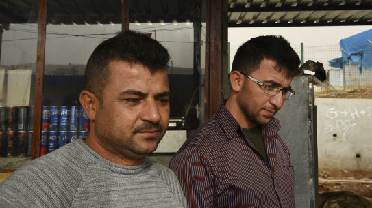 Brothers Aram, 31, (left) and Raman, 35, who was kidnapped by the Free Syrian Army, in front of their kebab shop in Basirma refugee camp. 