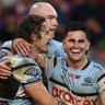 Daniel Atkison (right), Nicho Hynes and Tom Hazleton (centre) celebrate a try against the Roosters.