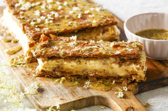 Vanilla slice with passionfruit drizzle and elderflowers (optional).