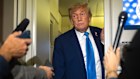 President Donald Trump speaks with reporters while flying aboard Air Force One en route from Calgary, Canada to Joint Base Andrews in Maryland.
