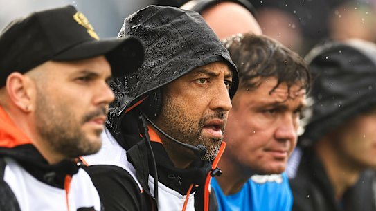 Wests Tigers coach Benji Marshall (second from left) on the bench in Tamworth.