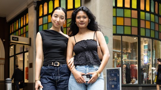 Sydney actors Priyanka Thandar and Ronisha Bhandari use colorful QVB windows in the background.