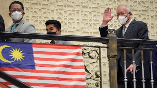 Najib Razak waves to supporters as he arrives at court for his final appeal in August.