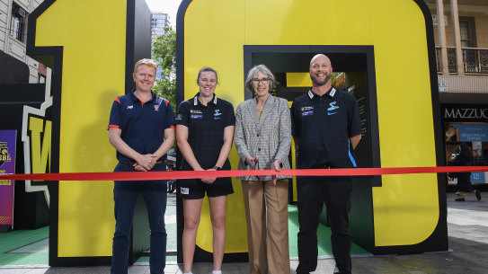 Jane Lomax-Smith mayor of Adelaide cuts the ribbon watched by SACA’s  CEO Charlie Hodgson, Strikers captain Tahlia McGrath and Strikers coach Luke Williams launching the new WBBL season.
