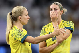 Kaitlyn Torpey and Alanna Kennedy were dejected after the losing to the USA.